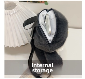 Internal storage detail of plush penguin backpack showing space for a smartphone