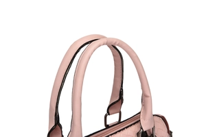 Detail view of pink woven handbag handle with reinforced stitching and clean finish