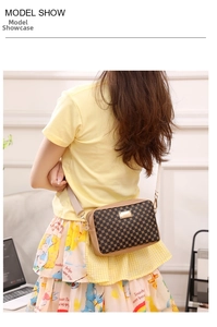 Modern crossbody bag featuring geometric patterns and a stylish woven strap worn by a model