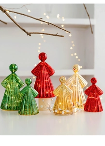 Close-up of six glowing glass angel ornaments in red, green and gold with LED lights