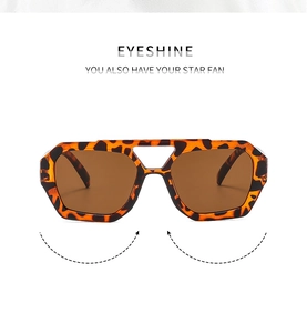Detail of tortoiseshell aviator sunglasses featuring a double bridge and tea-colored lenses