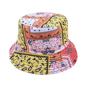 Detail of colorful paisley print bucket hat with stitched brim and vibrant cotton fabric