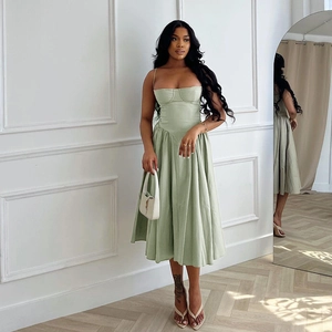 Full view of light green midi dress with cinched waist and pleated A-line skirt