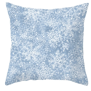 Close-up of blue snowflake pattern on a square pillowcase for winter Christmas decor