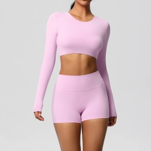 Detail of lavender long-sleeve crop top and high-waist shorts for fitness training
