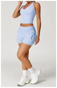 Light blue yoga set featuring V-neck halter tank top and side drawstring shorts detail