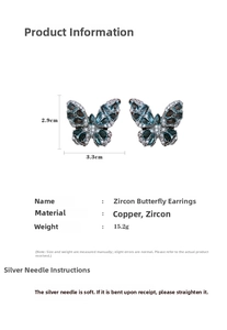 Detail of zircon butterfly earrings with dimensions 2.9cm x 3.3cm and material specifications