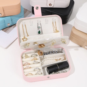 Detail view of pink portable jewelry box with velvet interior slots and color options