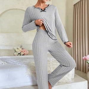 Women's grey ribbed lounge set with black lettuce edge trim and small bow detail