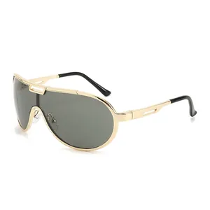 Golden aviator style oversized metal frame sunglasses with dark grey one-piece lens