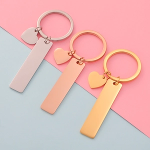 Minimalist rectangular and heart pendant keychains in silver, gold, and rose gold finishes