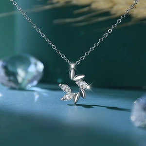 Close-up of S925 silver leaf pendant necklace with marquise-cut marquise stones