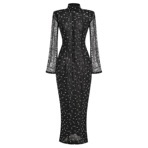 Detailed view of black mesh maxi dress featuring sheer sleeves and sparkling rhinestones