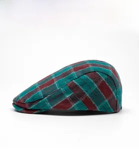 Side view of vintage red and green plaid flat cap with premium wool blend texture