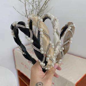 Detail of twisted fabric headbands with faux pearls and rhinestones in four colors