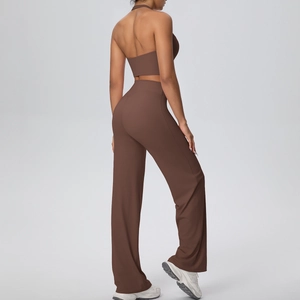 Detail of mocha brown backless halter yoga top and high waist straight leg sports pants