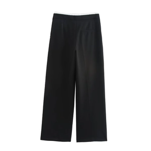 Detail of high-waist wide-leg black trousers featuring smooth fabric and elegant drape