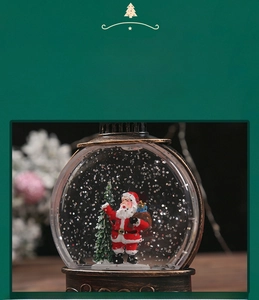 Detailed view of Santa Claus snow globe with bronze base and transparent ABS globe