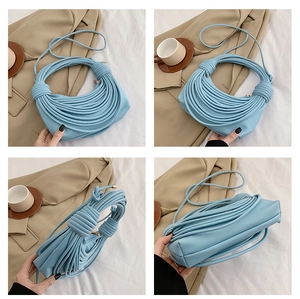 Detail shots of light blue pleated shoulder bag with unique knotted knot texture