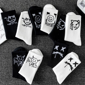 Streetwear monster graffiti cotton sports socks in classic black and white crew length