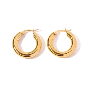 Minimalist gold hoop earrings for women made of polished stainless steel on white background