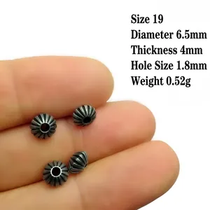 Macro detail of 6.5mm antique silver pumpkin spacer bead with size and weight specs