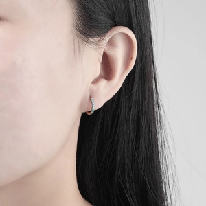 Fashion huggie hoop earrings with micro-set turquoise zircons in polished silver finish