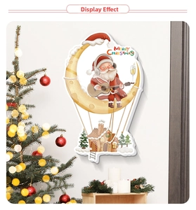 Detail view of Santa on moon wall sticker with Merry Christmas hanging houses