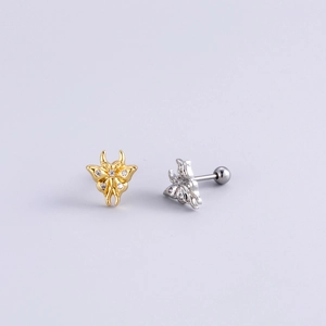Golden and silver butterfly cartilage studs with colorful zircon on a white background