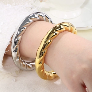 Exaggerated spiral hollow stainless steel open bangles in 18k gold and silver finish