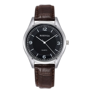 Detail of quartz watch featuring dark brown crocodile leather strap and black dial