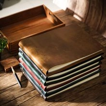 Stack of vintage crazy horse leather bookmarks in dark brown, green and burgundy tones