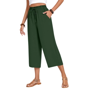 Detail of high waisted dark green linen wide leg pants with drawstring elastic waist and pockets