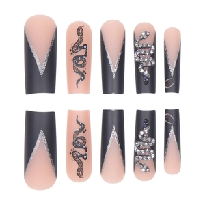 Long matte black and pink press-on nails with 3D silver snake rhinestones and French V-tips