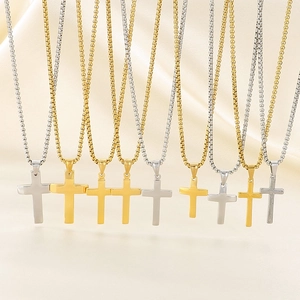 Minimalist gold and silver polished cross necklaces with classic box chains in a row