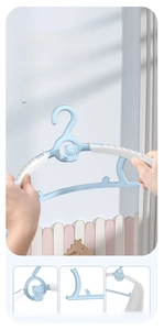 Flexible blue baby hanger showing durable plastic material and space-saving hooks