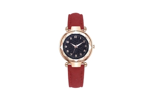 Detail of starry blue dial with diamond-cut glass and rose gold numerals on watch