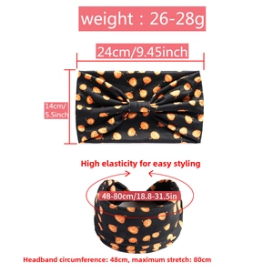 Detailed view of Halloween headband dimensions showing pumpkin print and elastic fabric stretch
