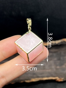 Pink quartz cube pendant with gold plated edges shown with 3.8cm height dimensions