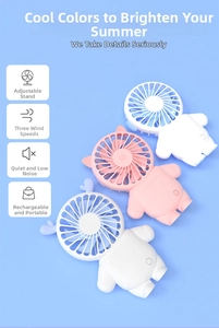 Close-up of portable cat-shaped mini fans in three colors with USB charging bases