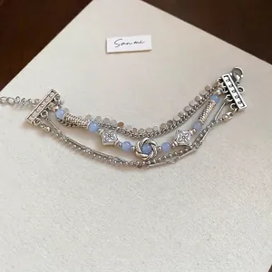 Vintage multilayer silver chain bracelet with geometric pendants and blue crystals
