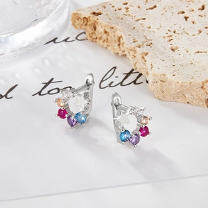 Close-up of S925 sterling silver earrings with multi-color zircons and star charms