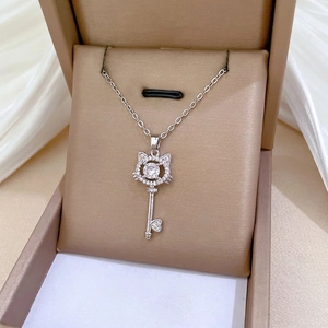 Titanium steel cat-ear key pendant necklace with zircon crystals and a polished chain