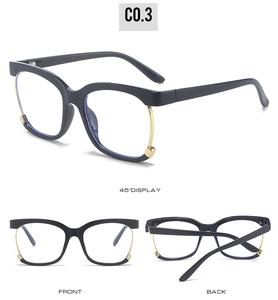 Detail showing retro black and gold semi-rimless square eyewear frame with metallic hinges