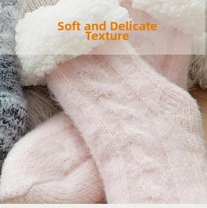 Close-up of pink cable knit floor socks with thick white sherpa lining for winter