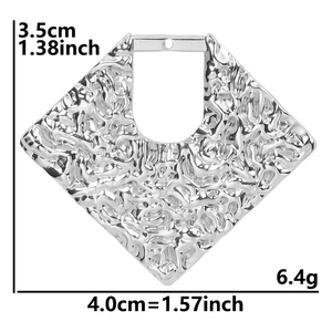 Silver geometric rhombus pendant detail with hammered texture and 3.5cm by 4.0cm dimensions