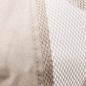 Macro detail of breathable mesh and twill stitching on the summer newsboy hat