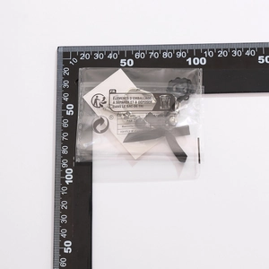Detail view of black necklace with star pendant measured by a ruler for sizing reference