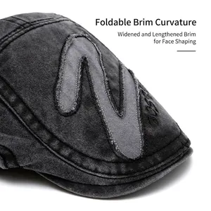 Vintage washed dark grey newsboy cap with M letter patch and foldable brim for men