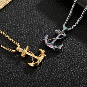 Detail of gold and rainbow anchor pendants with rope design on box chains